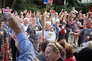 Les Carries the Olympic Torch
